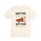 Beige t-shirt with a graphic and text 'Raise your voice not your fist' – empowHER by Heidi political protest apparel