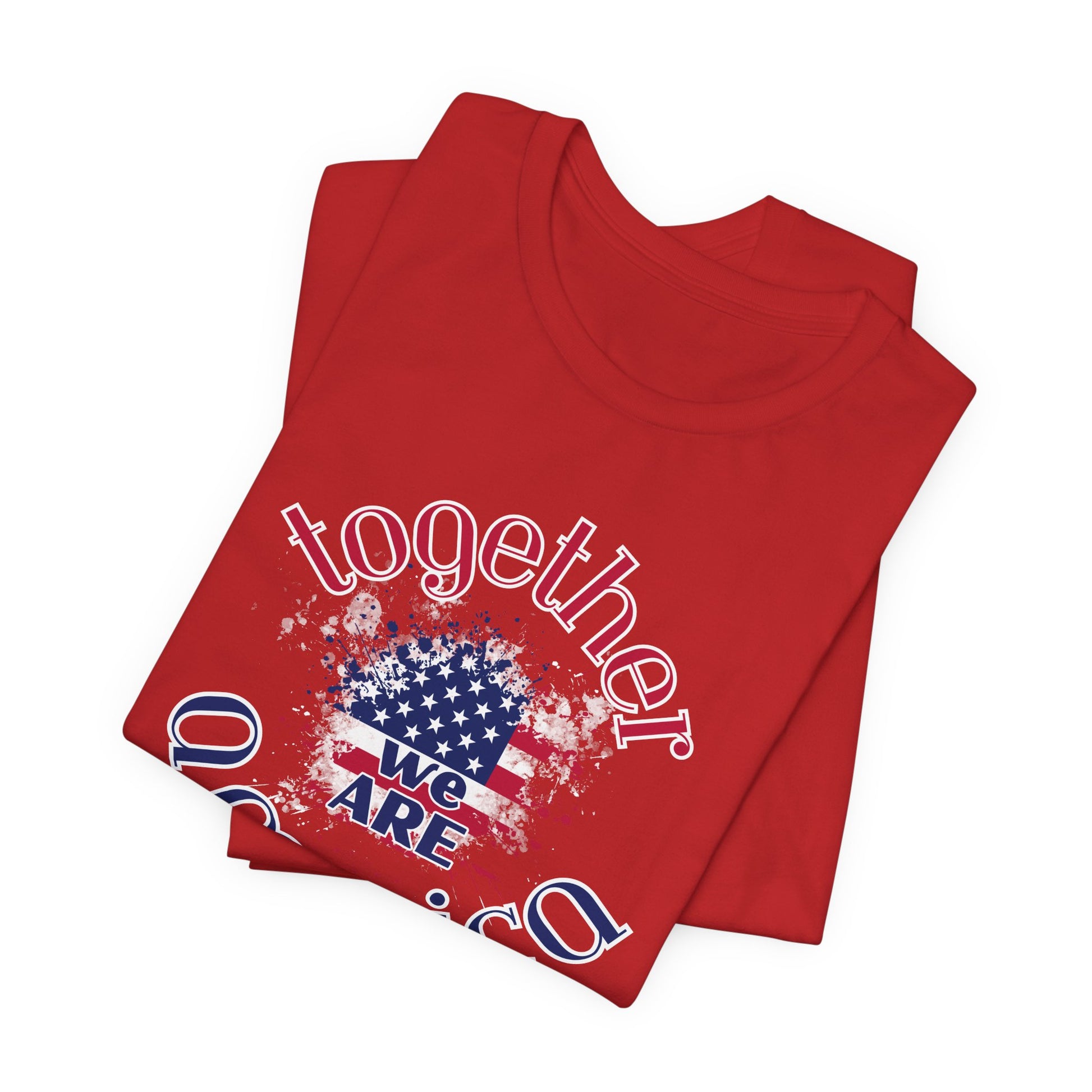 Folded red t-shirt with 'Together We Are America' graphic design on a white background