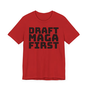 Red t-shirt with 'DRAFT MAGA FIRST' text on a plain background