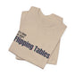Folded tan t-shirt with text "It's Time to Start Flipping Tables" by empowHERbyHeidi