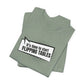Folded green sage t-shirt with cartoon speech bubble with text "It's Time to Start Flipping Tables" by empowHER by Heidi