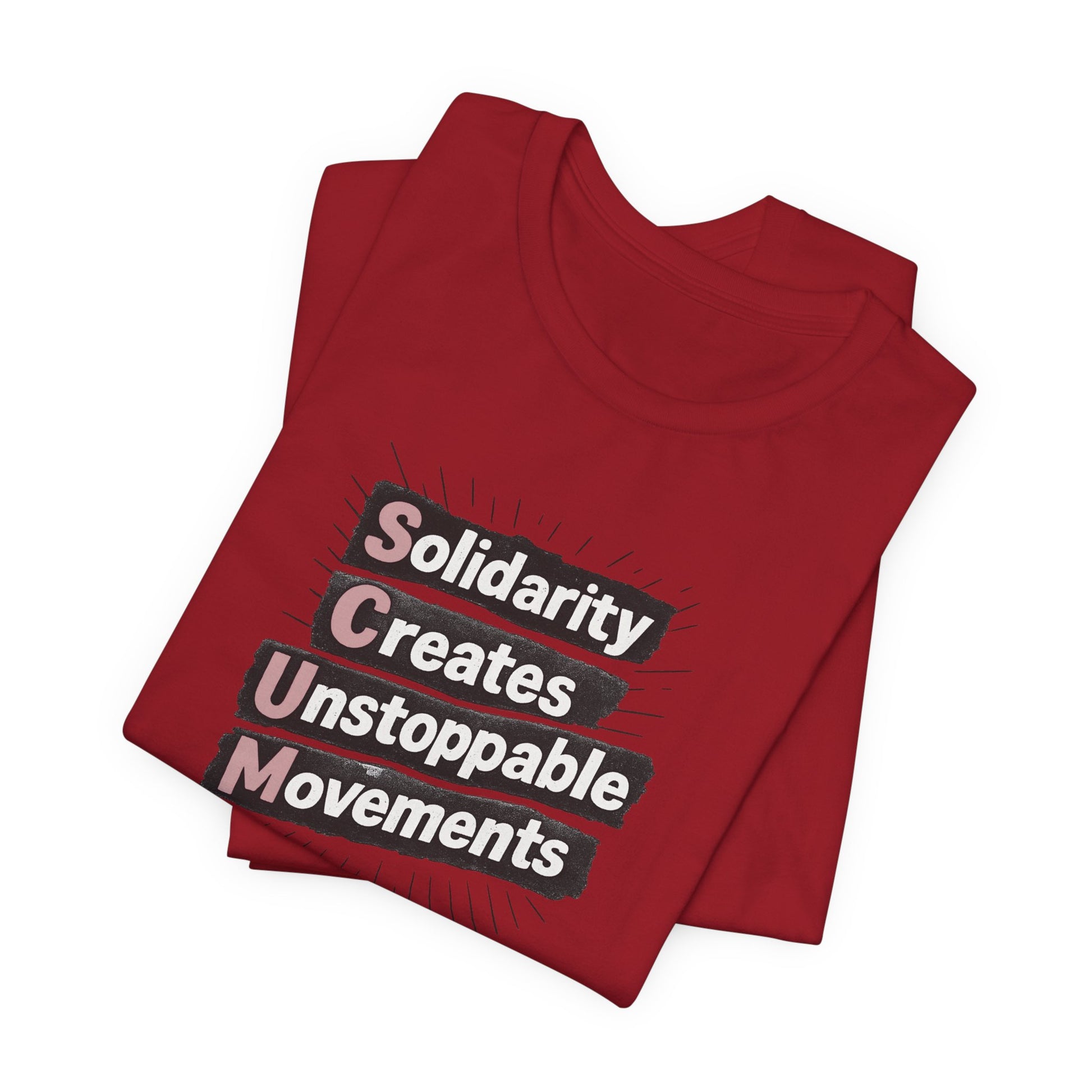 Folded red t-shirt with motivational quote "solidarity creates unstoppable movements" by empowHER by Heidi