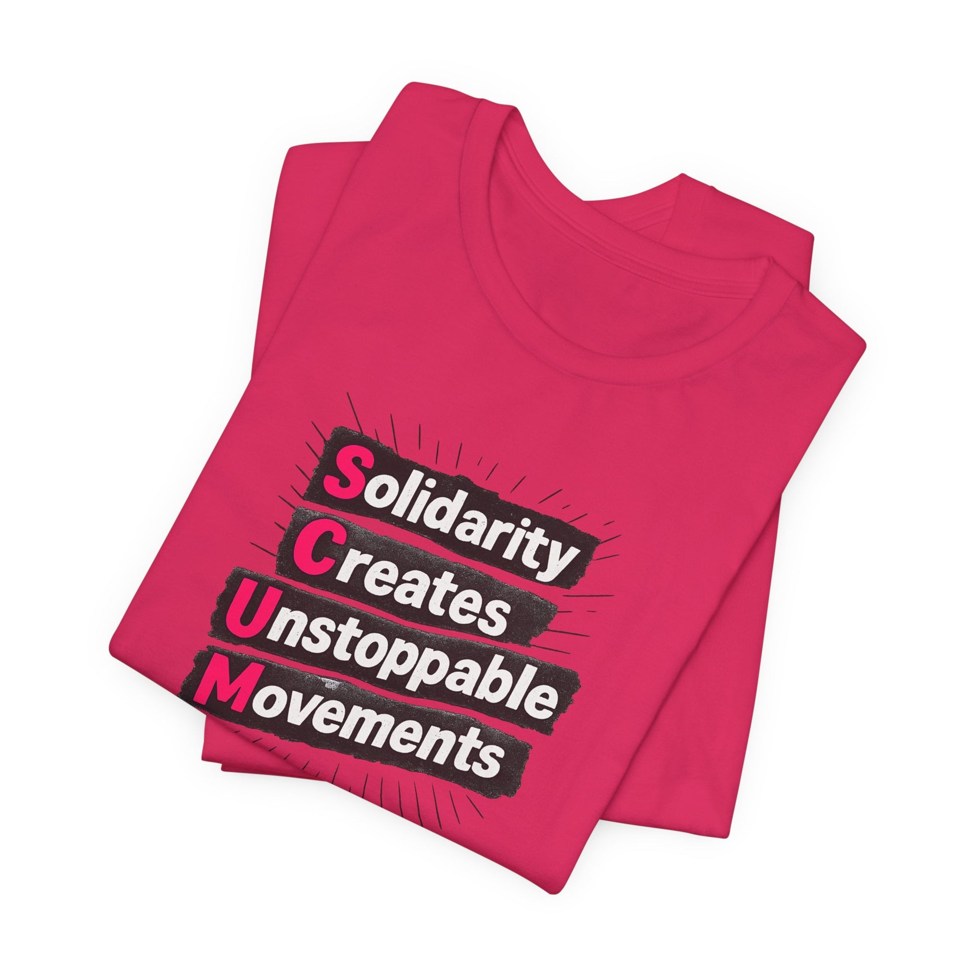 Folded pink t-shirt with motivational quote "solidarity creates unstoppable movements" by empowHER by Heidi
