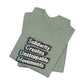 Folded sage green t-shirt with motivational quote "solidarity creates unstoppable movements" by empowHER by Heidi