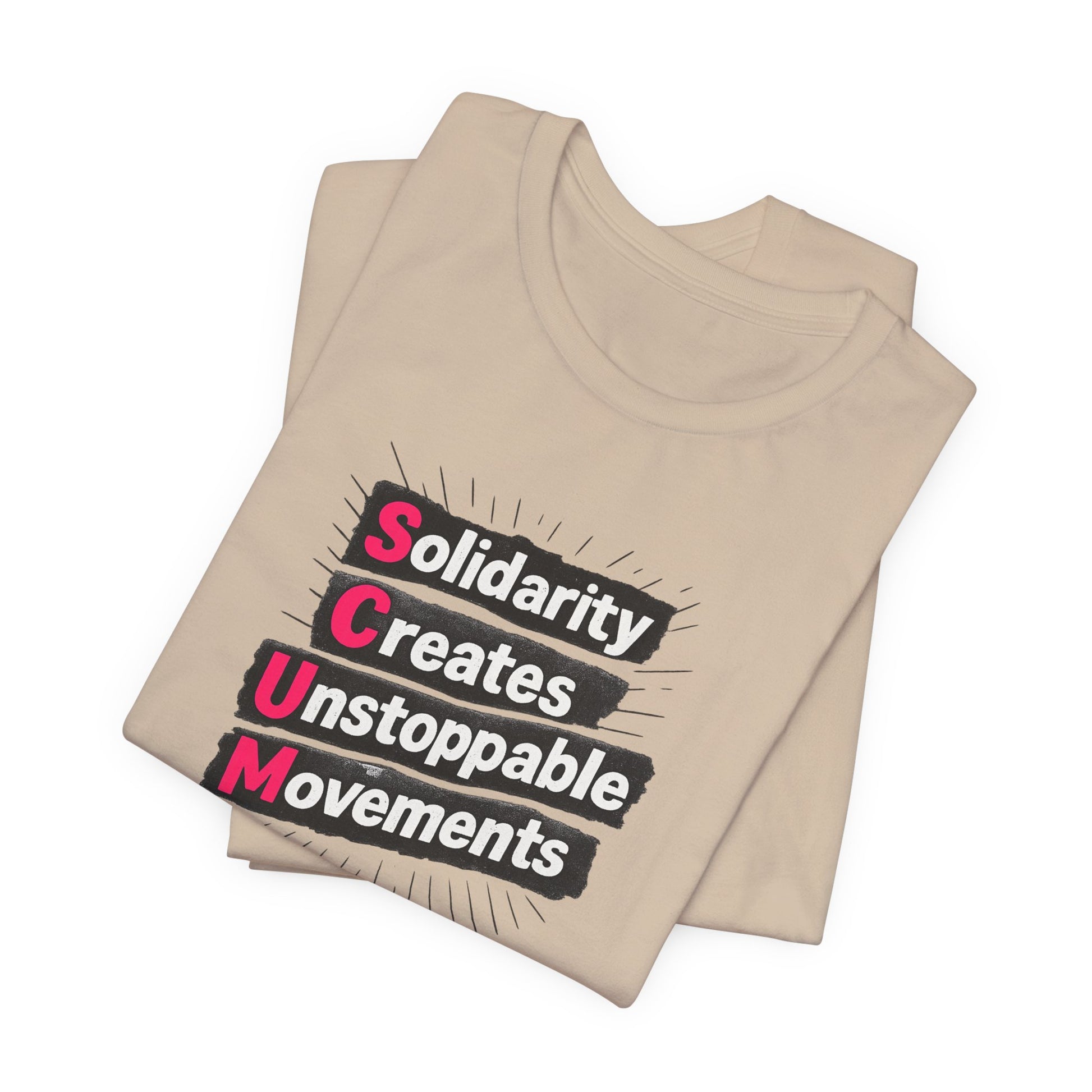 Folded beige t-shirt with motivational quote "solidarity creates unstoppable movements" by empowHER by Heidi