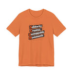 Oranget-shirt with motivational quote "solidarity creates unstoppable movements" by empowHER by Heidi