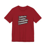 Red t-shirt with motivational quote "solidarity creates unstoppable movements" by empowHER by Heidi