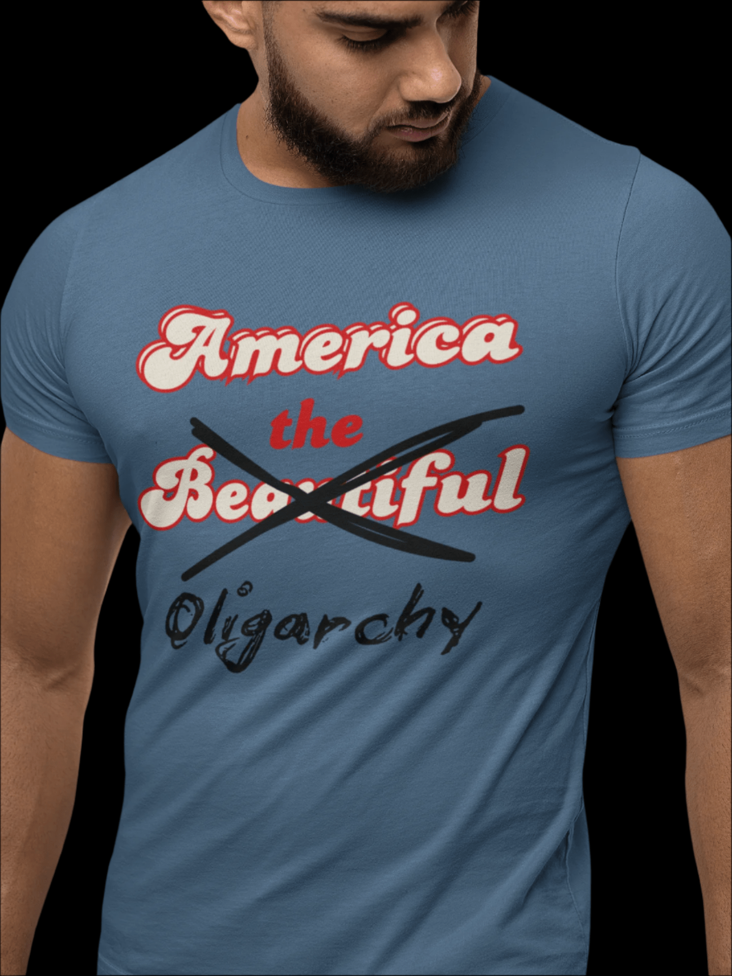 Stone blue t-shirt with the saying "america the beautiful" but "beautiful" is crossed out and replaced with the word "oligarchy"