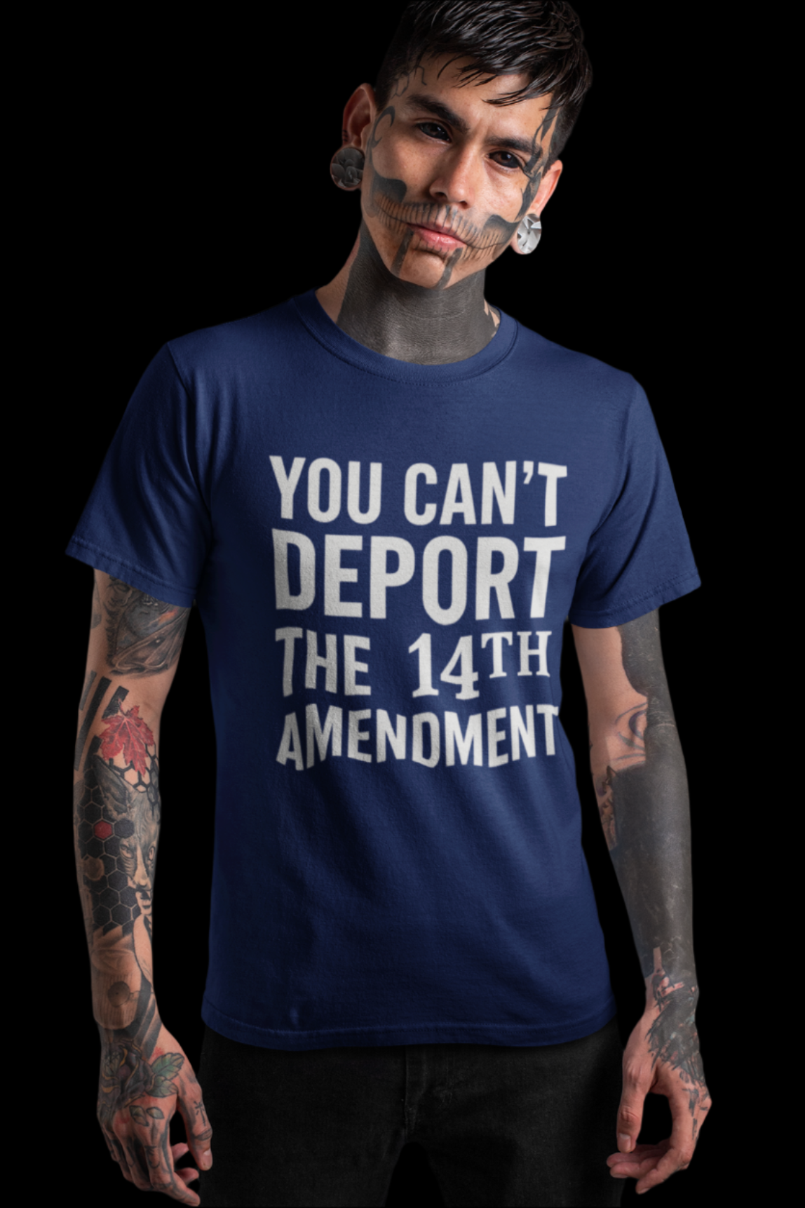 Person wearing a blue t-shirt with text that says "YOU CAN"T DEPORT the 14th AMENDMENT" on a dark background